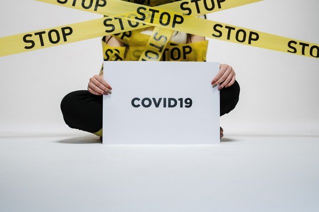 person holding covid sign 3951600